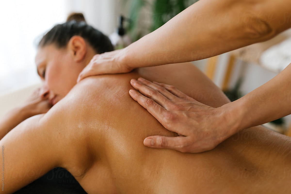 Middle age woman having professional massage at Spa