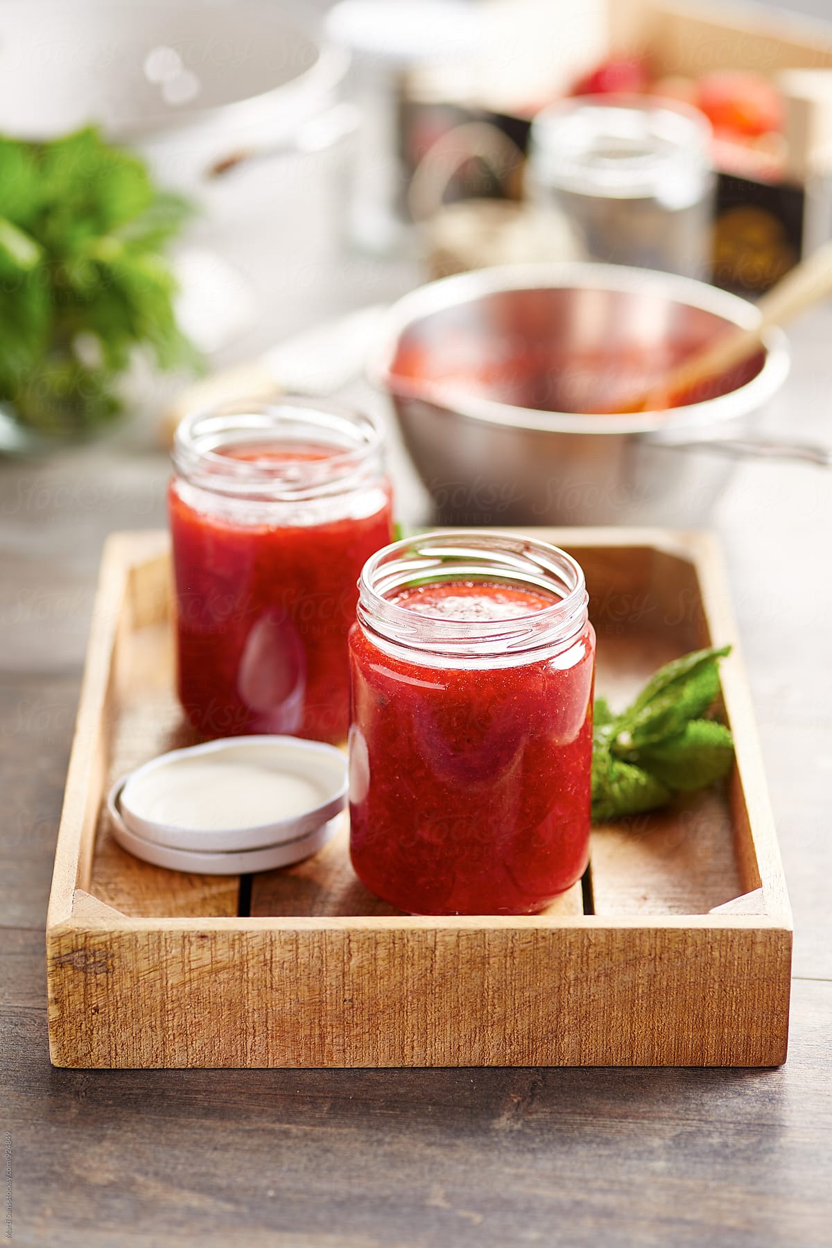 Sweet strawberry jam in glass cans