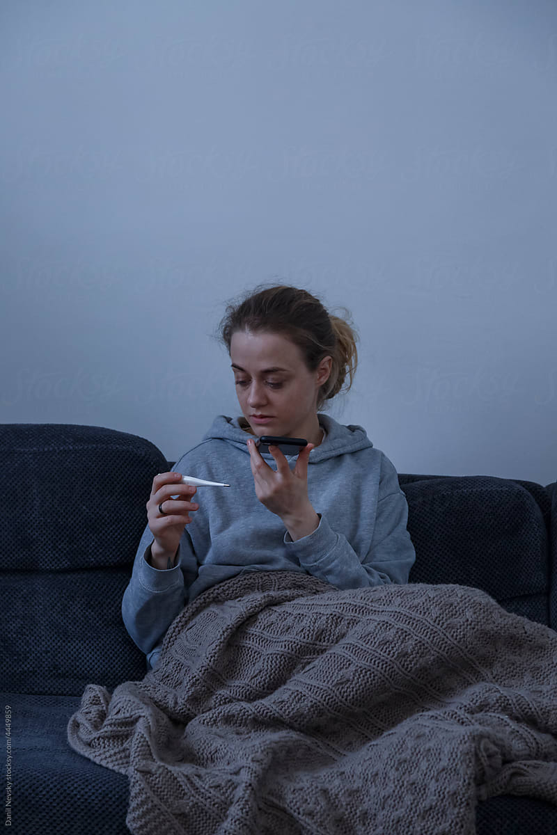Sick woman speaking to doctor on smartphone