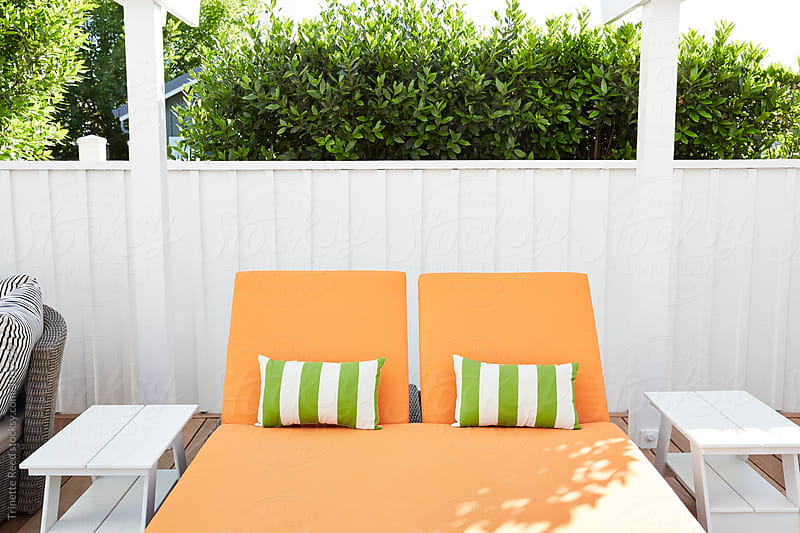 Lounge furniture at pool at luxury resort
