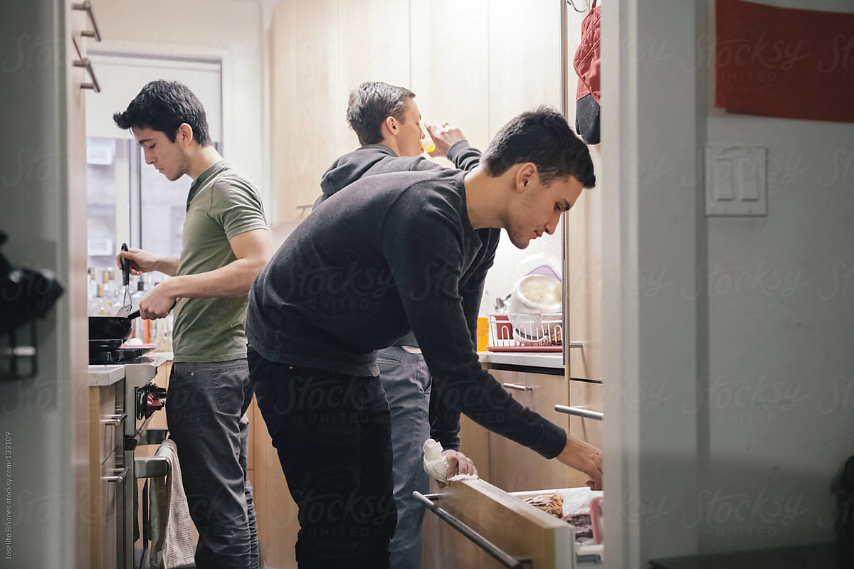 Student Roommates Preparing Breakfast in the Kitchen of their New York Apartment