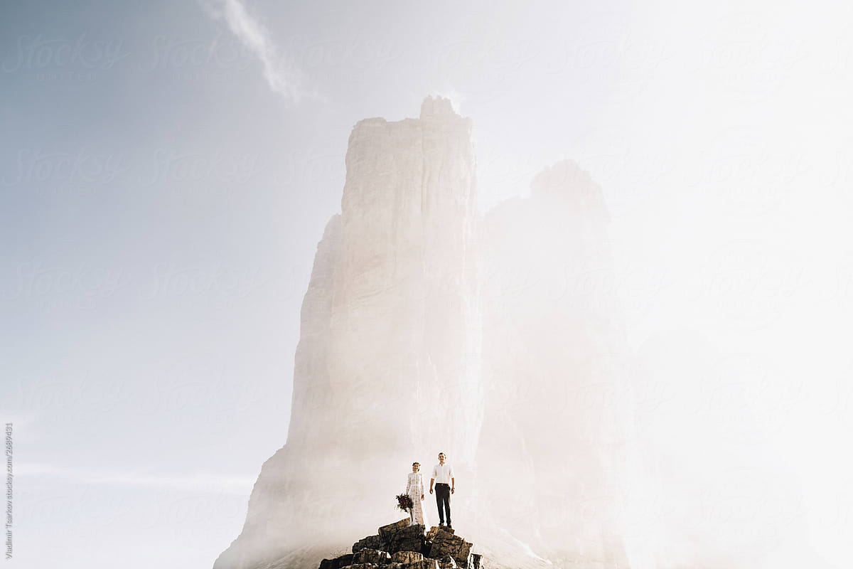 Epic Portrait Of Couple Standing In Clouds By Stocksy Contributor Vladimir Tsarkov Stocksy