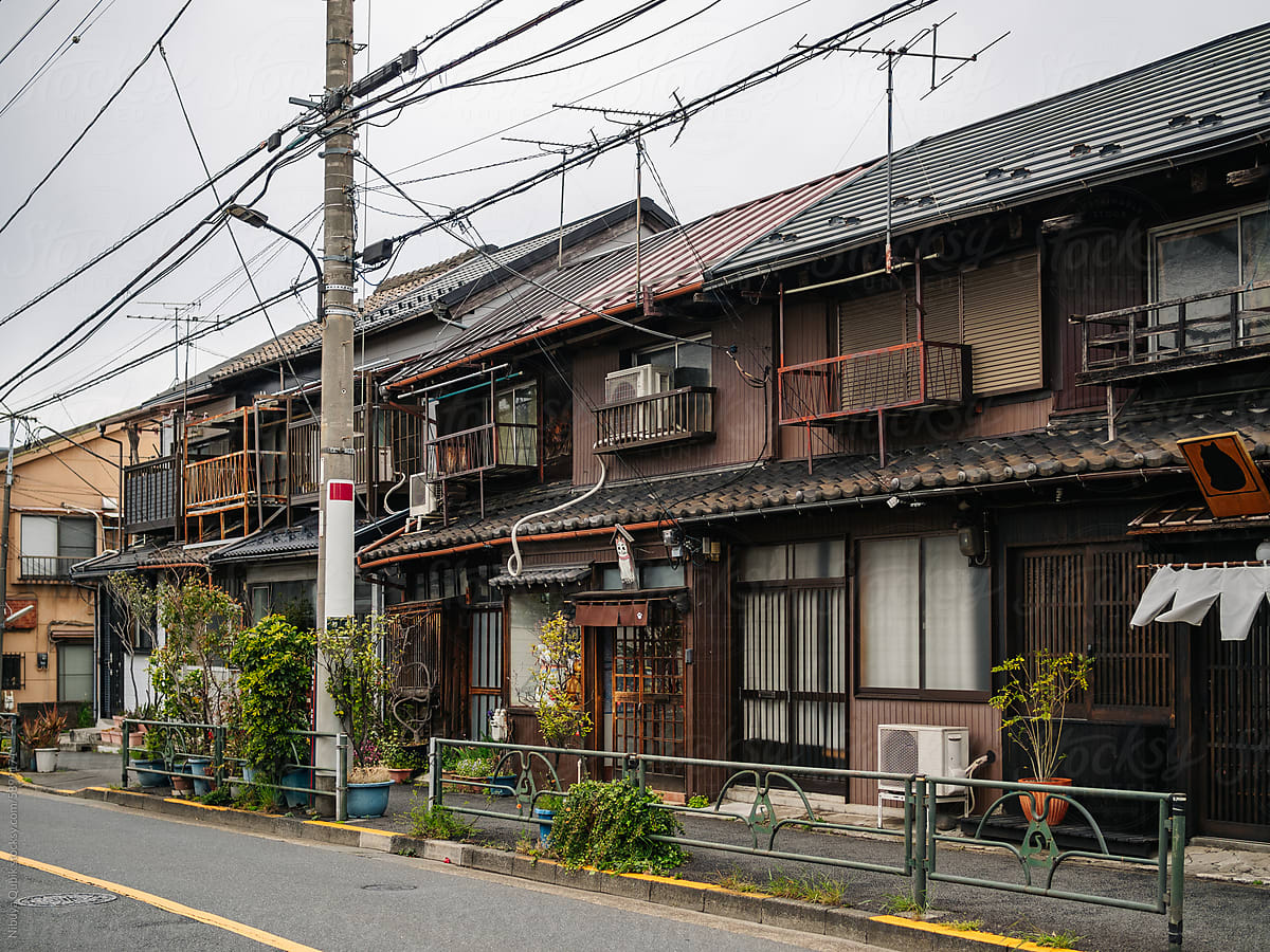 old buildings with power lines hanging outside in an old tokyo suburb