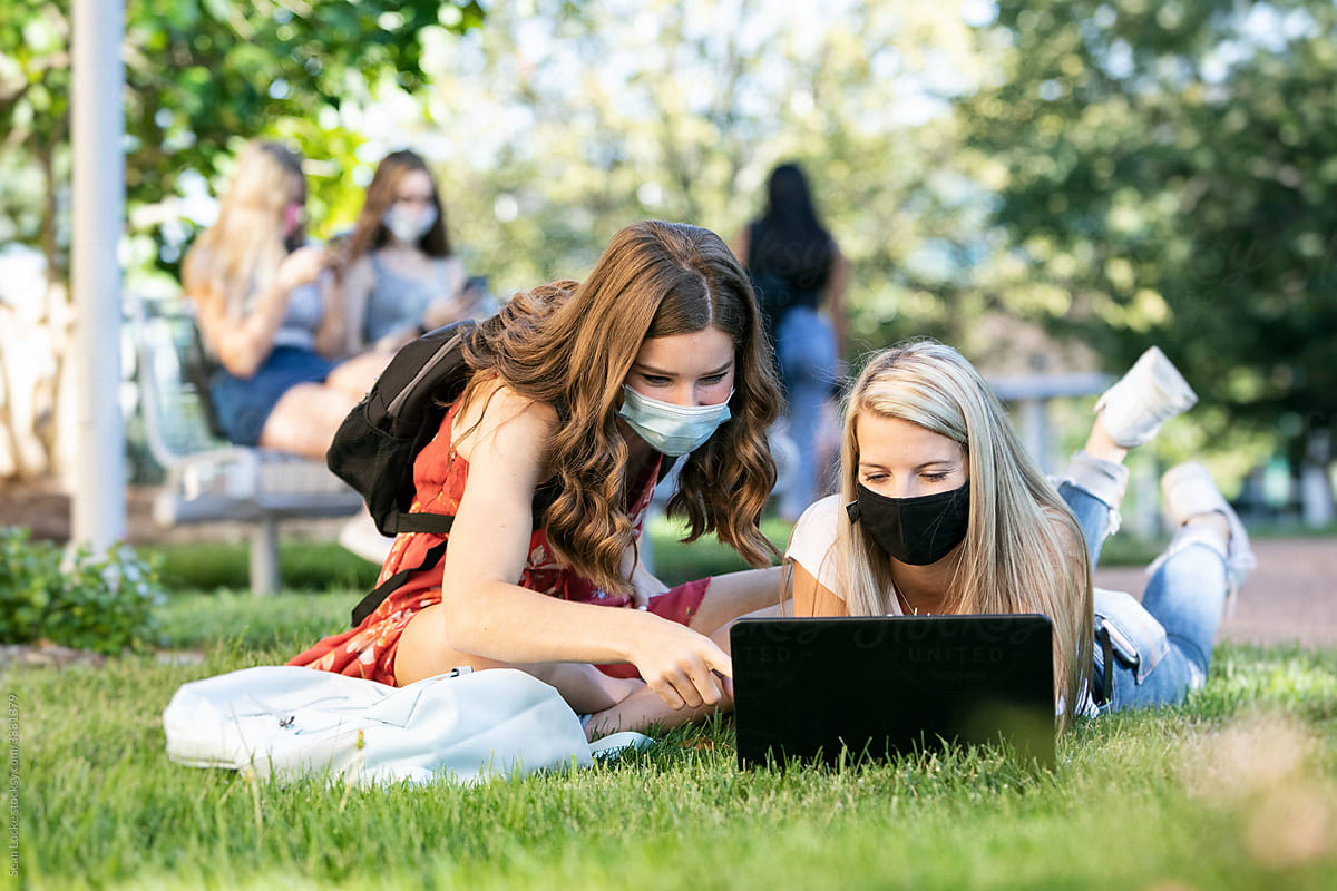 Covid: Friends With Face Masks Studying Remotely Outdoors