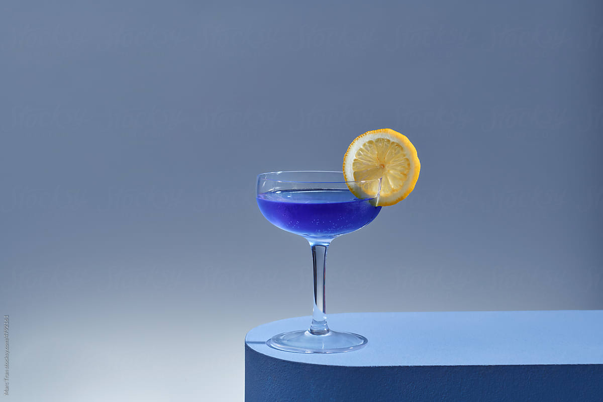 blue cocktail with fresh lemon