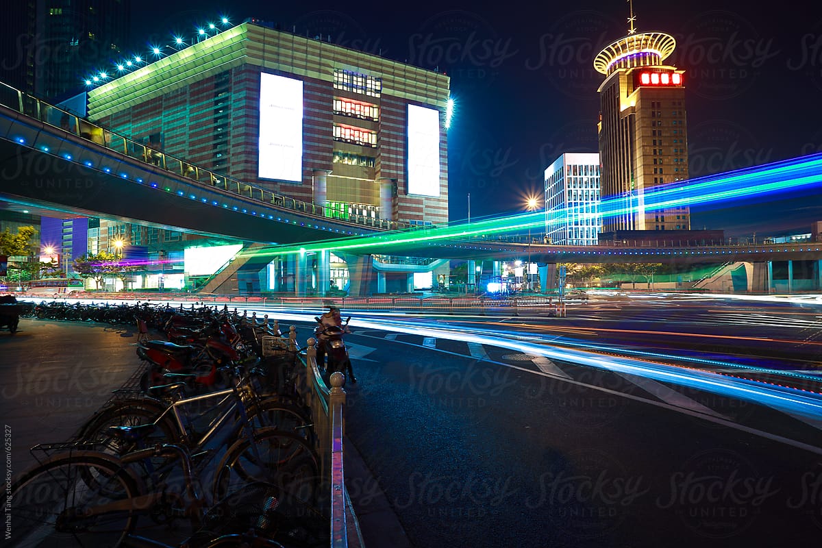 The highway car light trails of modern urban buildings