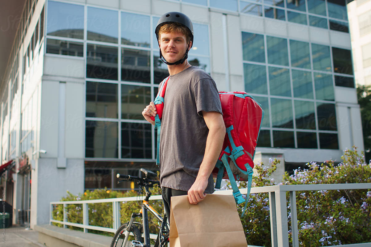 Young Delivery Man With Package
