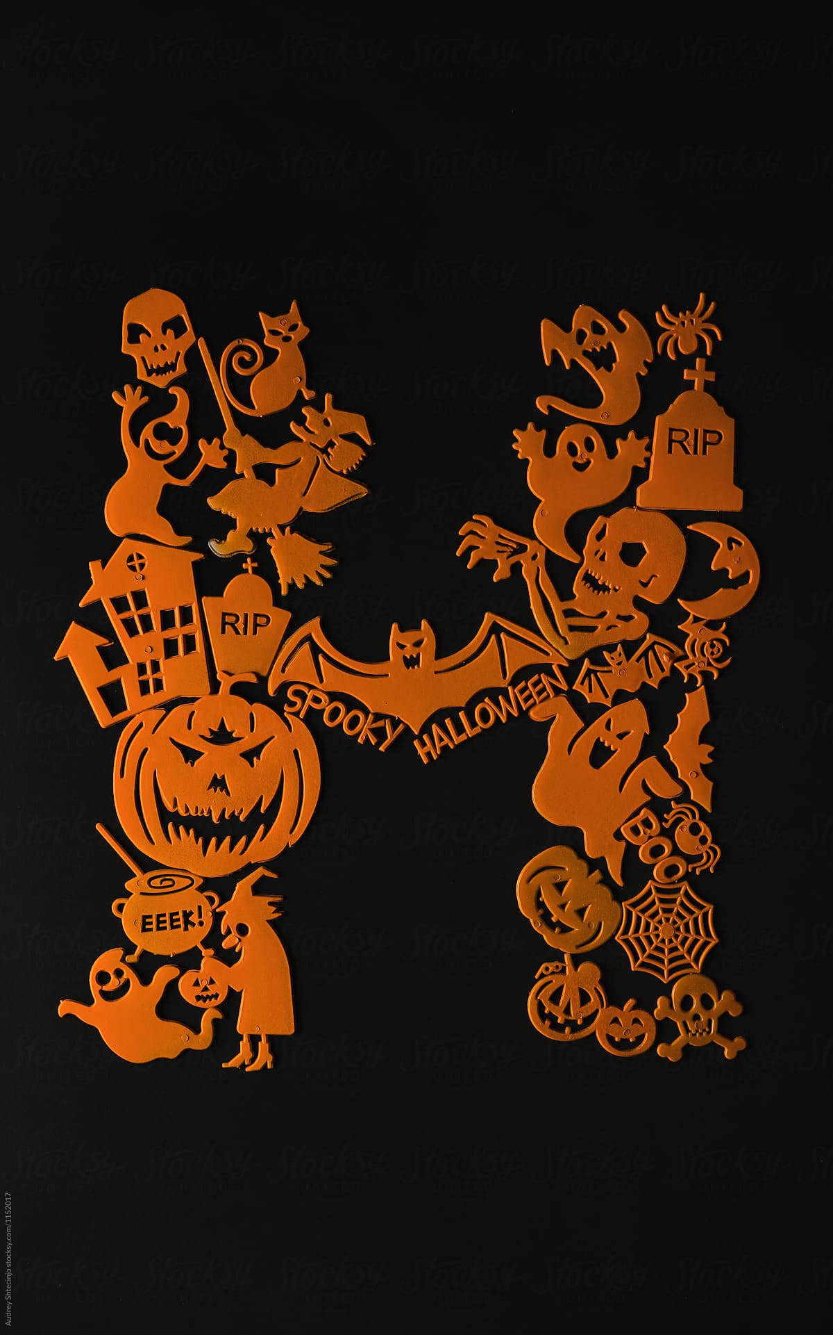 Orange Halloween decoration elements on black baground.