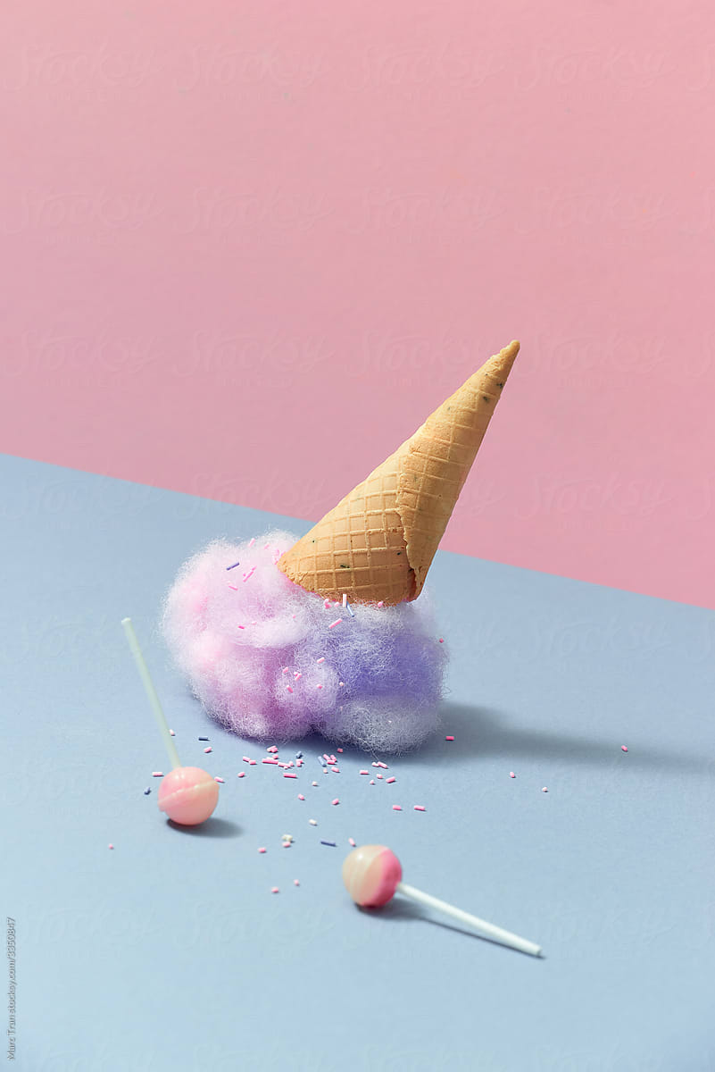 Ice cream cone fallen on pastel color background.