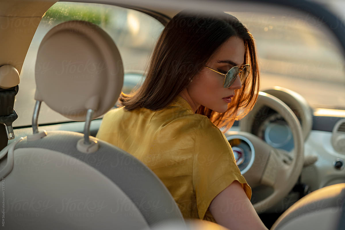 A Woman driving a car