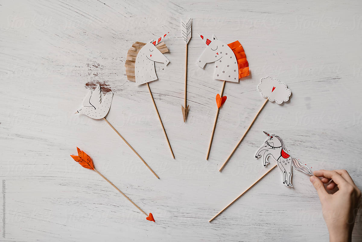Handmade paper cut toys on wooden wands