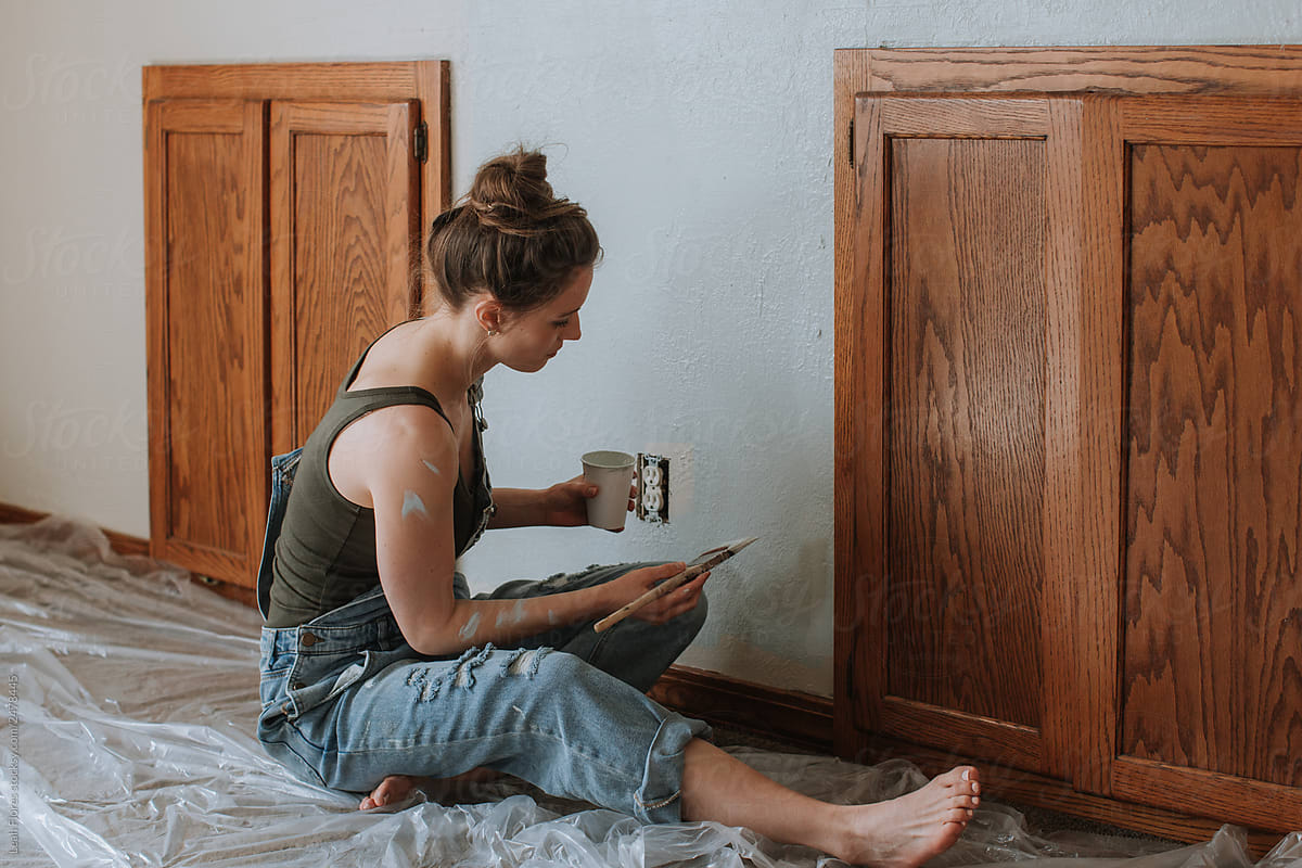 Woman Working on Paint Project in Home