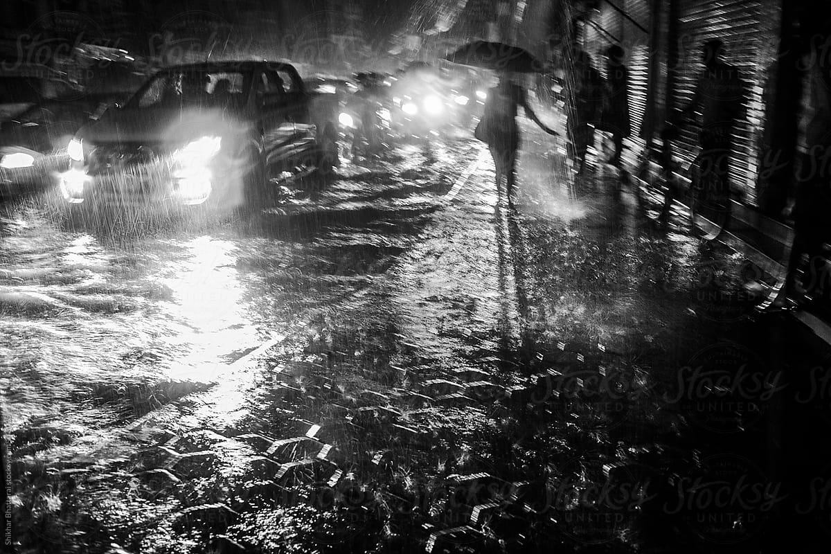 Chaotic monsoon scene of a city street in Asia.