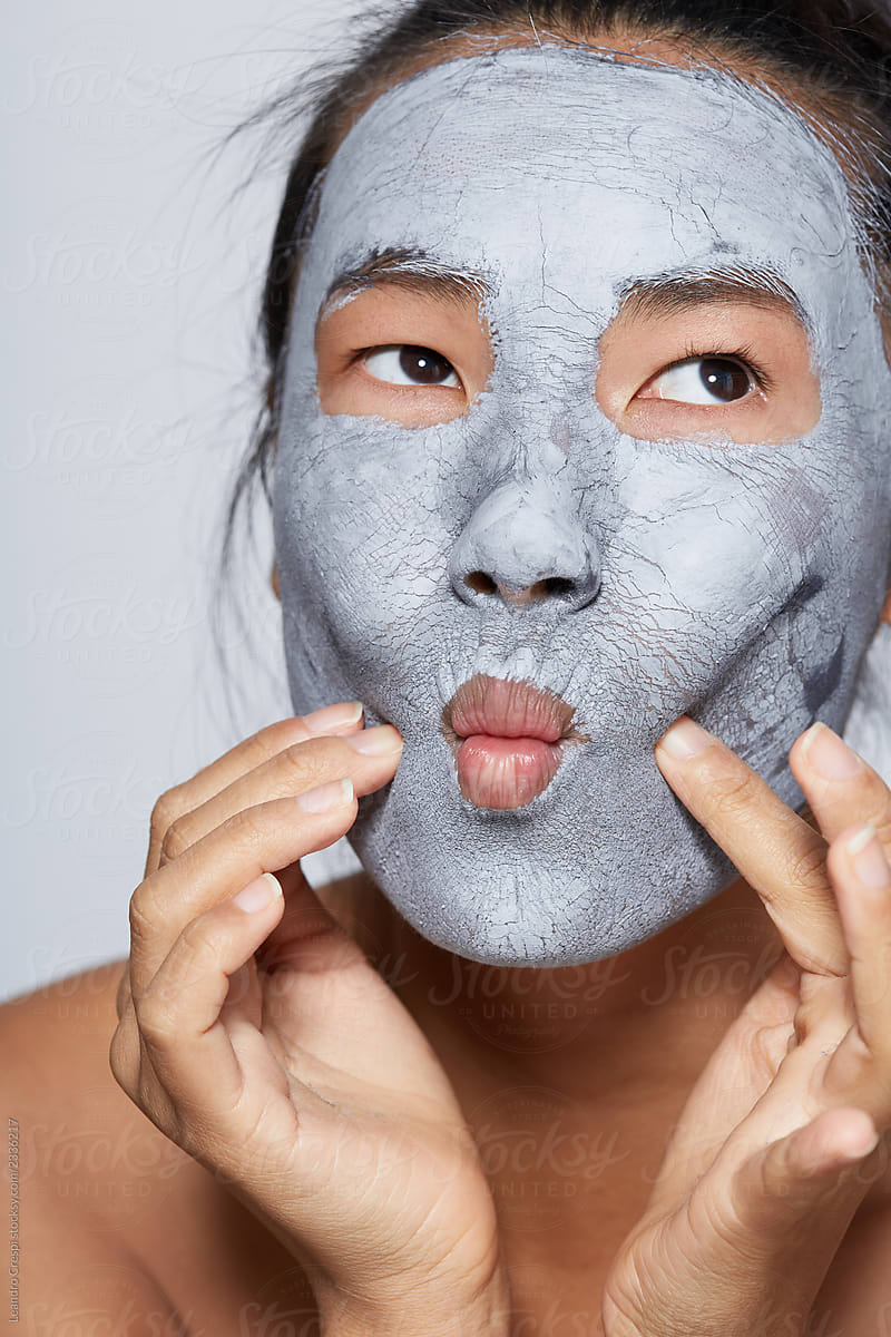 Woman playing with Mud mask on