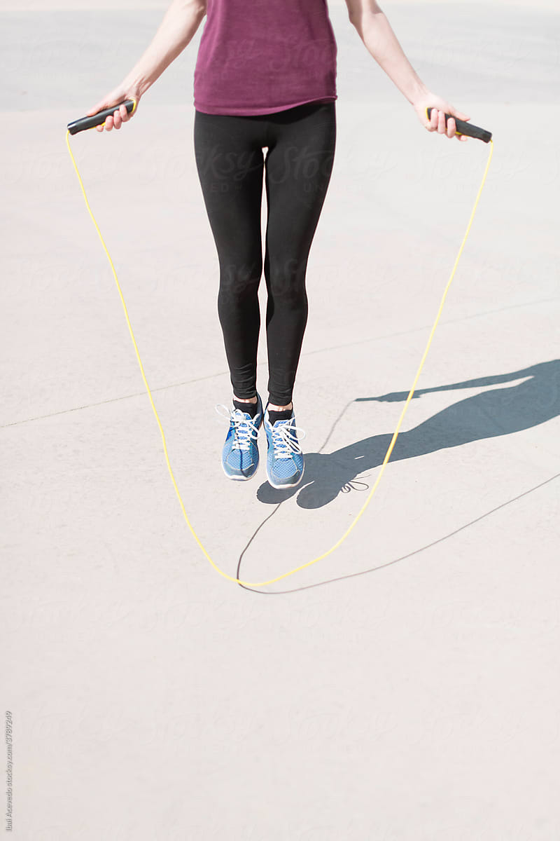 Girl in the air with a jump rope