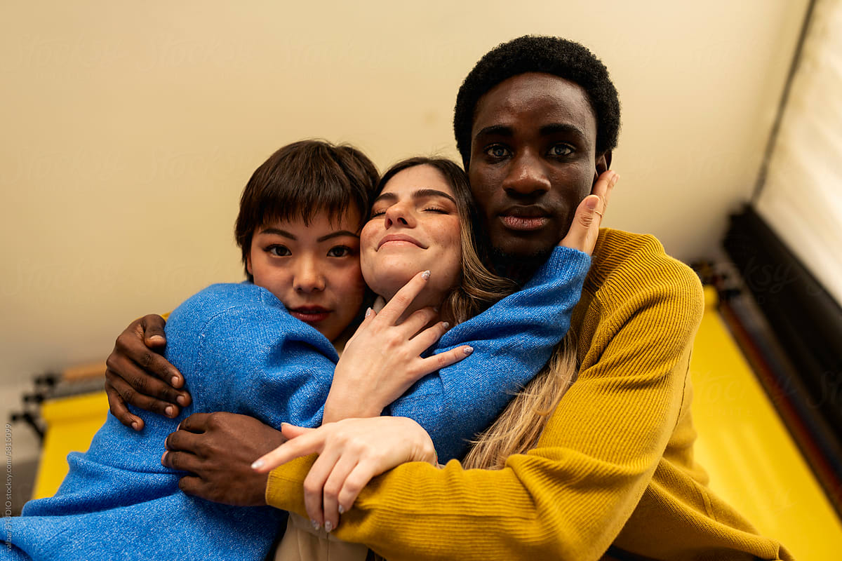 Diverse Young Friends Hugging