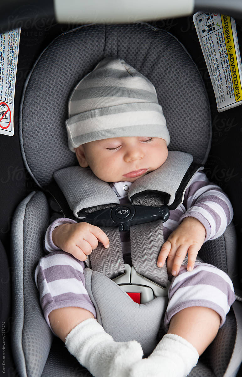 Is it safe for baby to sleep in car seat Baby Sleeping In Car Seat By Cara Dolan Stocksy United