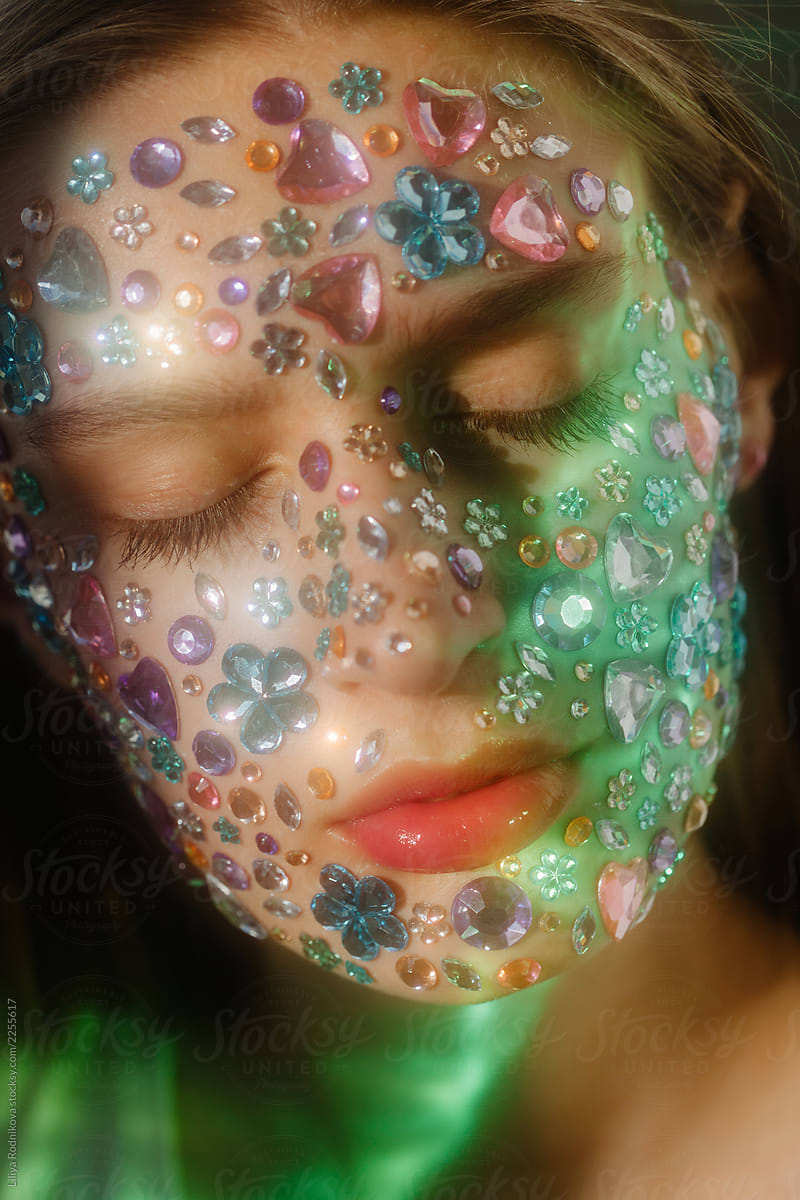 Closeup beauty portrait of face covered with crystals