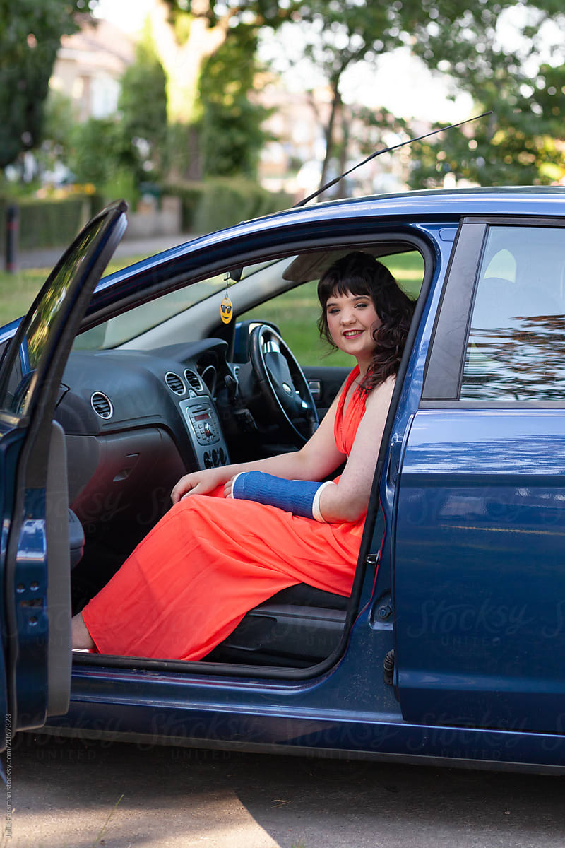 A young woman with special educational needs poses before setting off for her prom.
