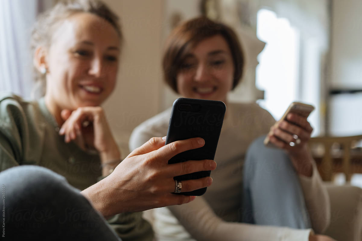 Young women looking at smartphone screen