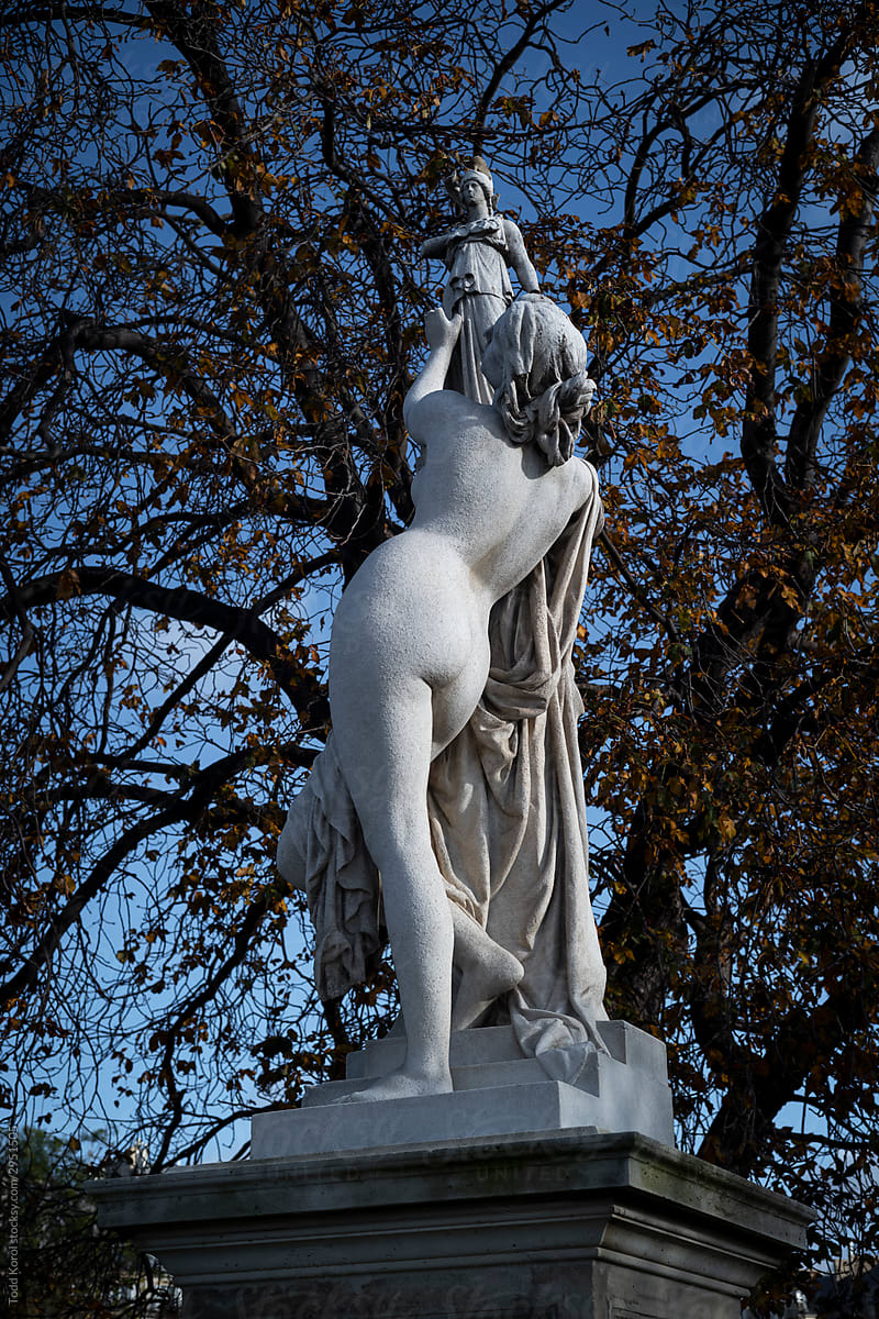 Nude sculpture in a garden in Paris , France.