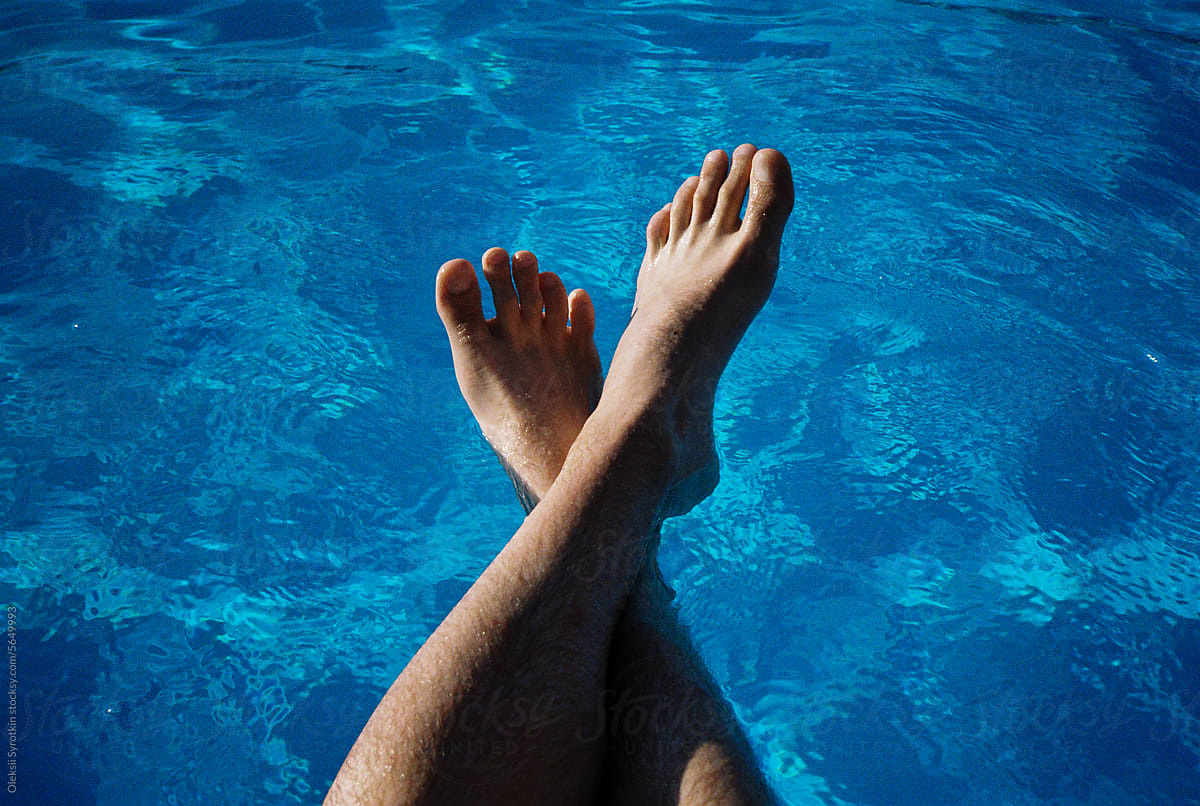 Anonymous body part leg swimming pool water relax freshen up chill out