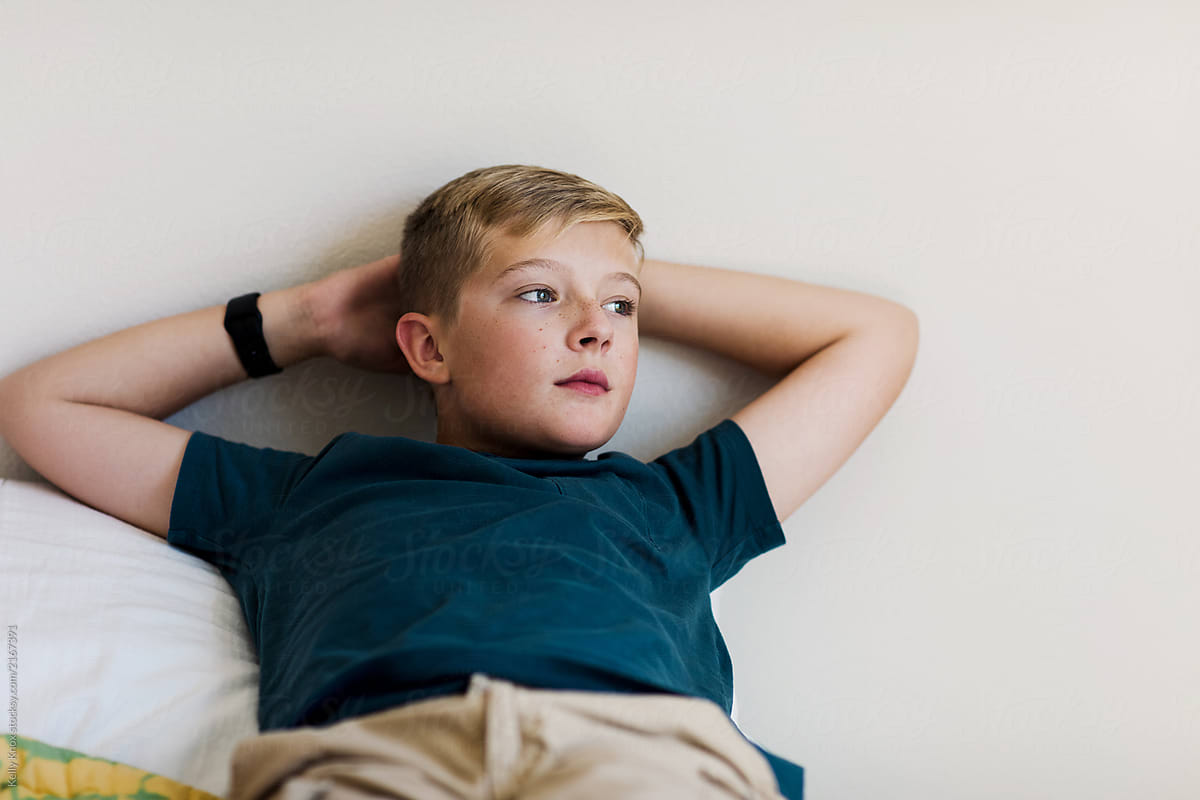 Portrait Of A Preteen Boy With Something On His Mind by Kelly Knox image