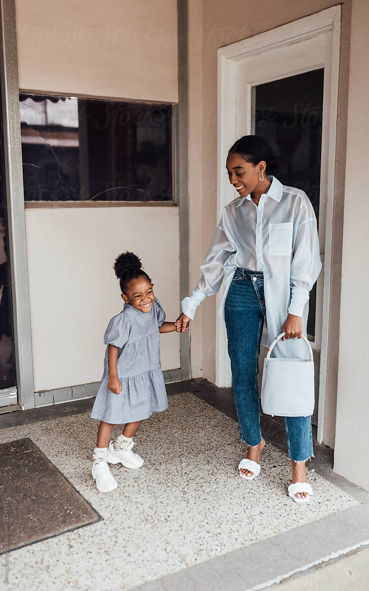 Stylish Mom And Daughter Walk In The City by Stocksy Contributor