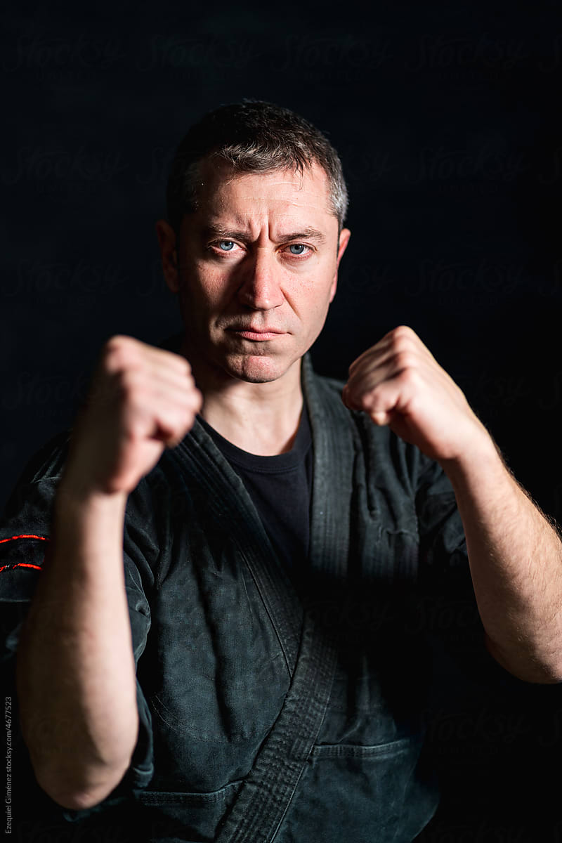 Middle aged fighter in attack stance