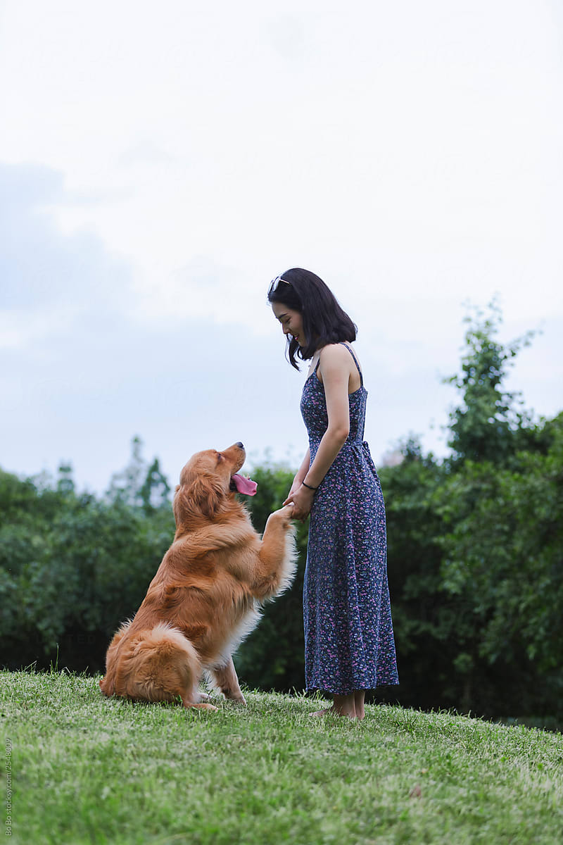 young asian woman with dog outdoor