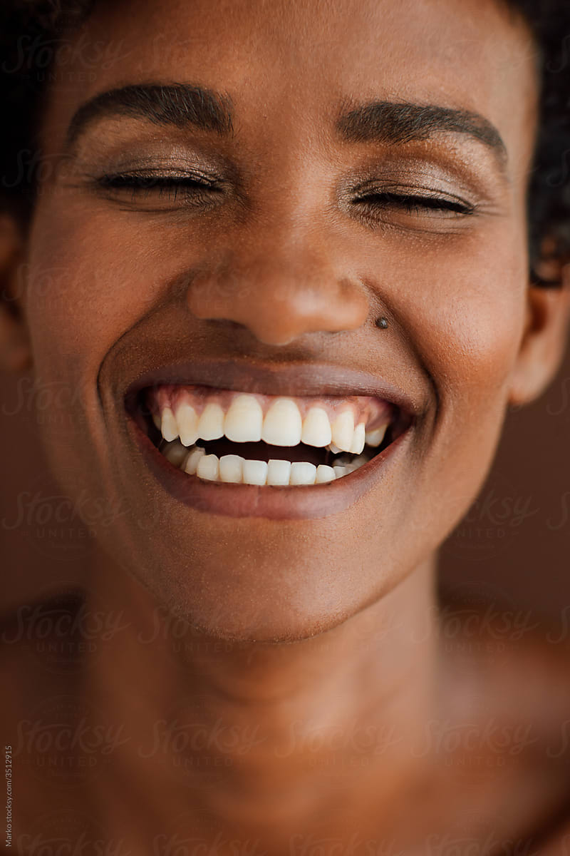 Studio portrait of woman laughing
