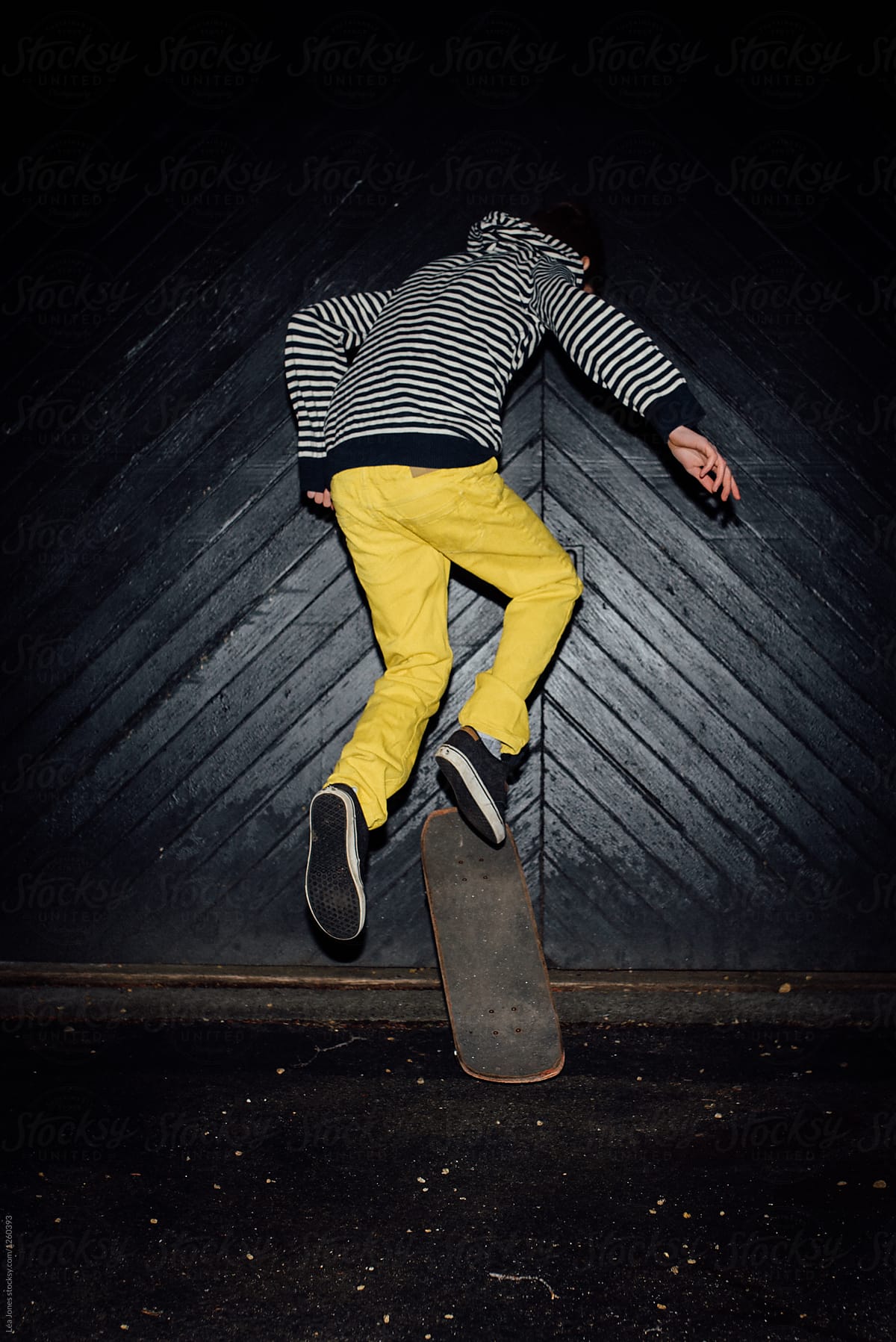 teen with yellow trousers on skateboard