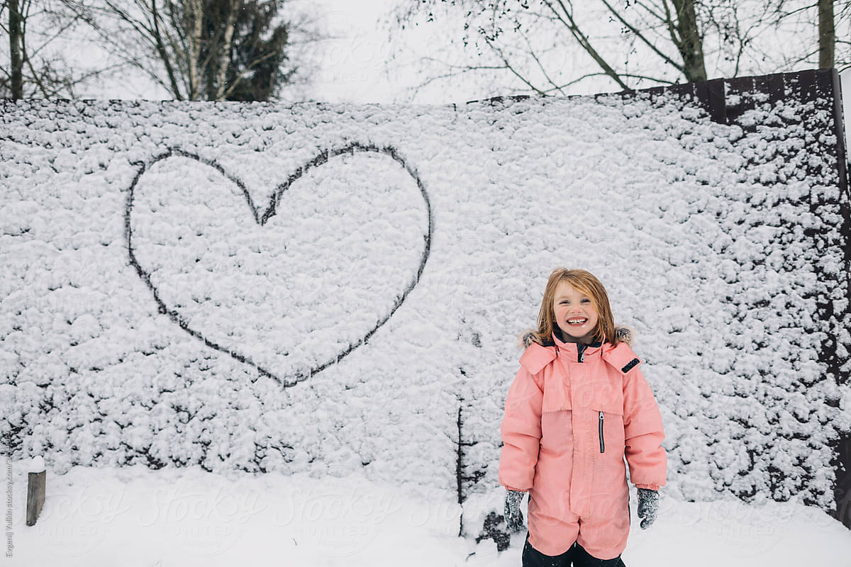 Little girl  and drawn heart