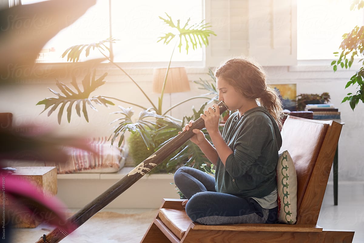 Didgeridoo player at home