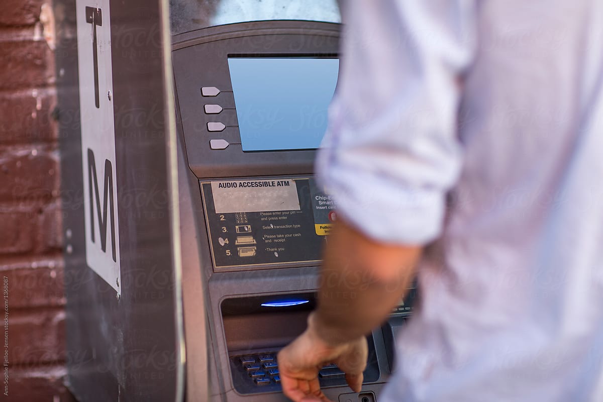 Man using an ATM.