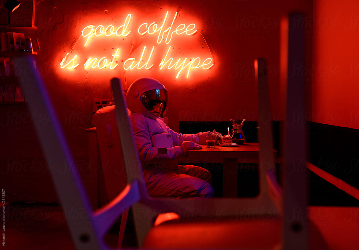 Lonely astronaut celebrating birthday in cafe