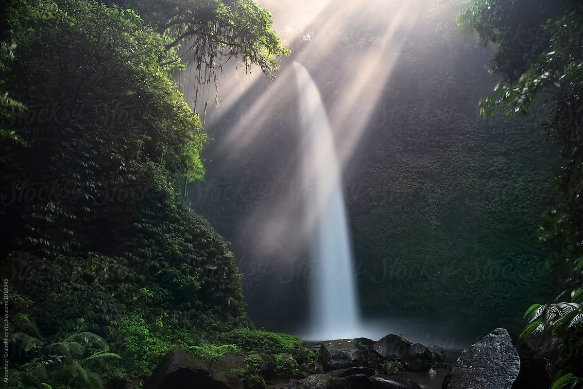 Tropical Waterfall In A Sunlight