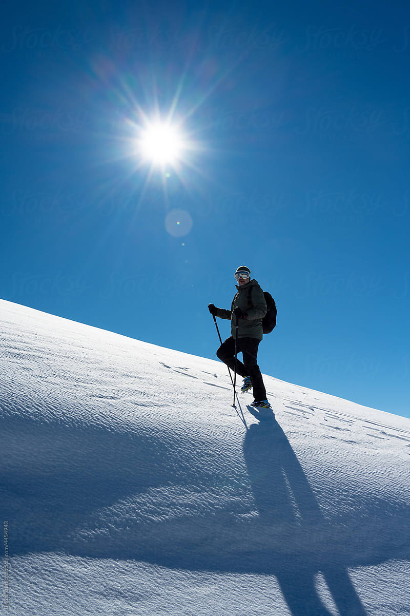 Man climbing in mountains in winter