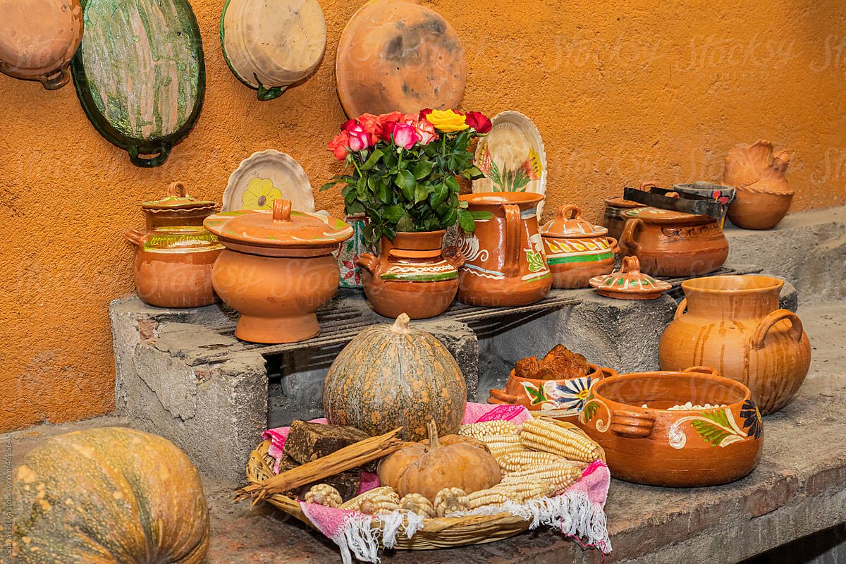 Clay pots in a traditional Mexican kitchen with flowers