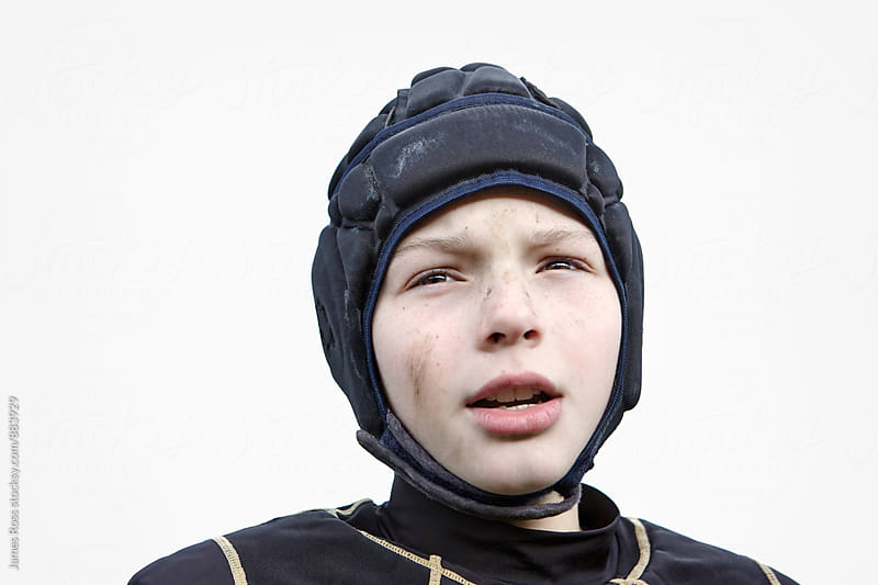 Teenage boy wearing head guard for sport