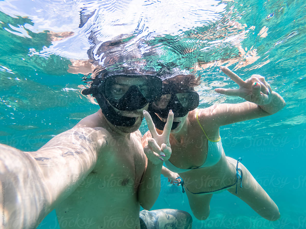 couple snorkelling in the sea in Thailand
