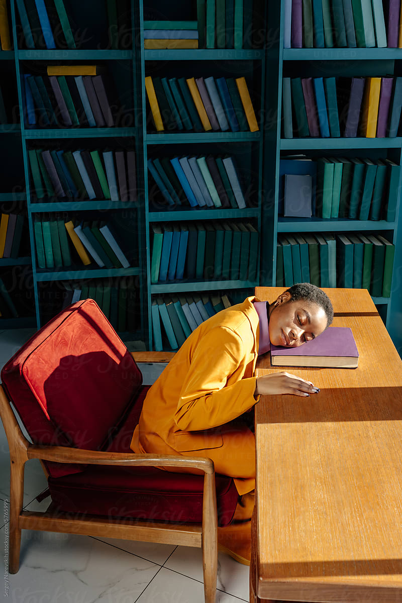 Woman sleeping in library