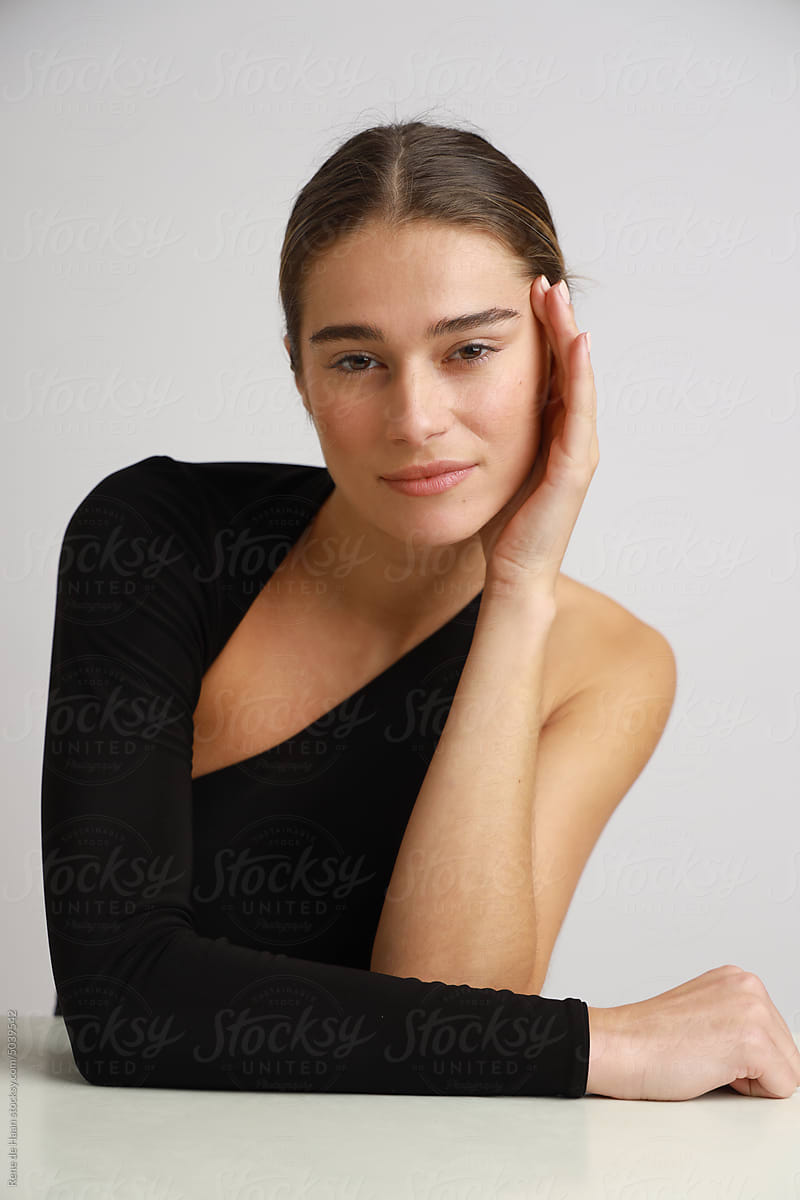 young woman leaning on table