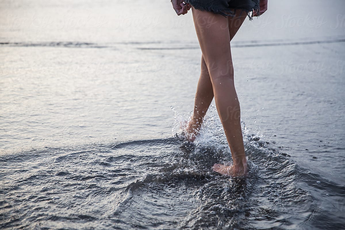 Woman Legs Walking Into The Water By Stocksy Contributor Jovo Jovanovic Stocksy