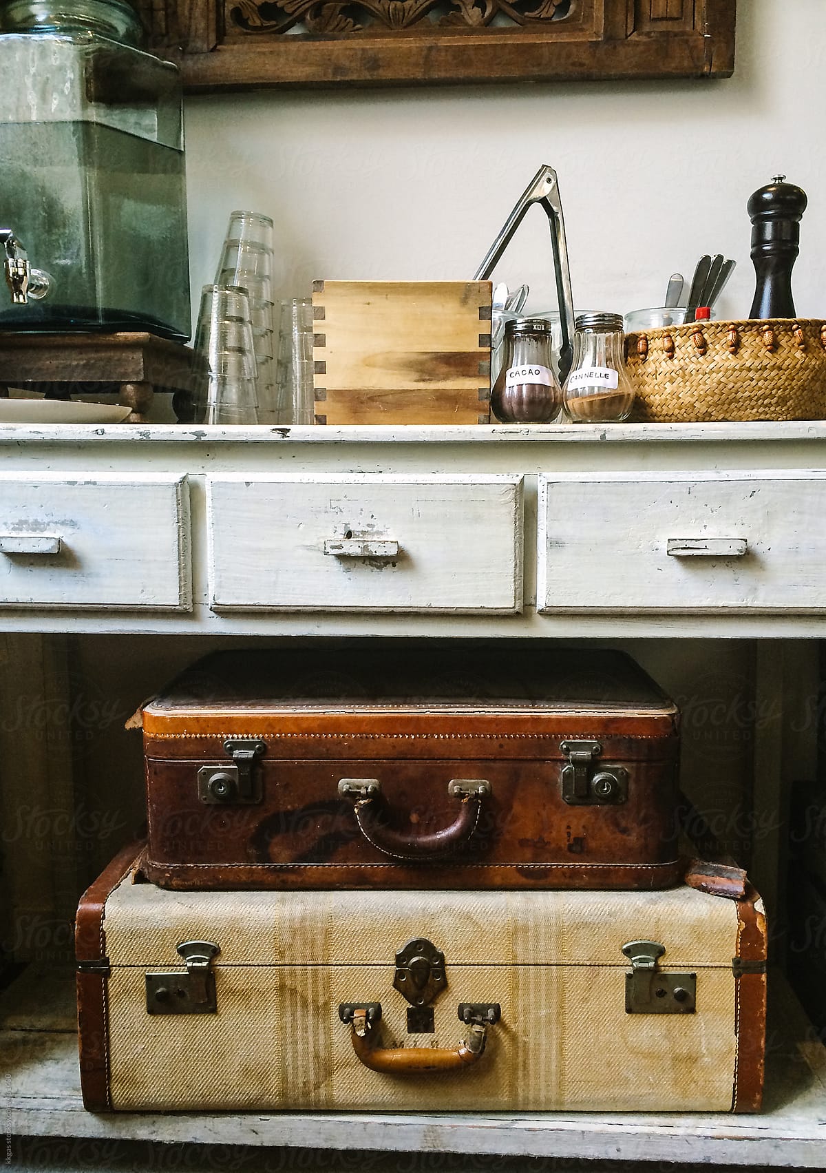 Vintage suitcases under Dresser