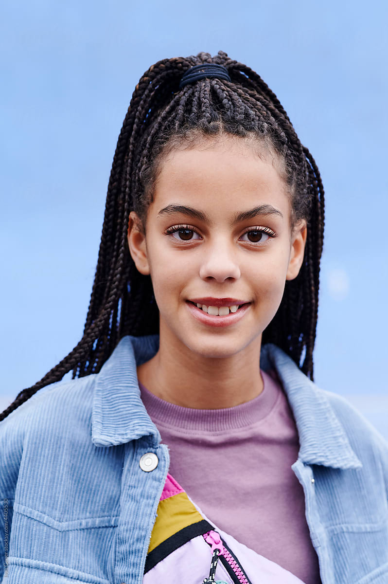 Teen girl with braided hair smiling