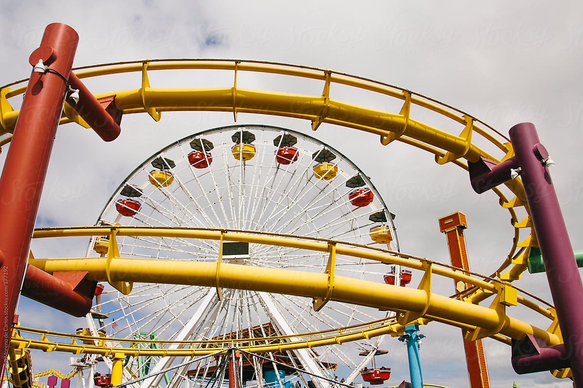 Rollercoaster and ferris wheel on a fair