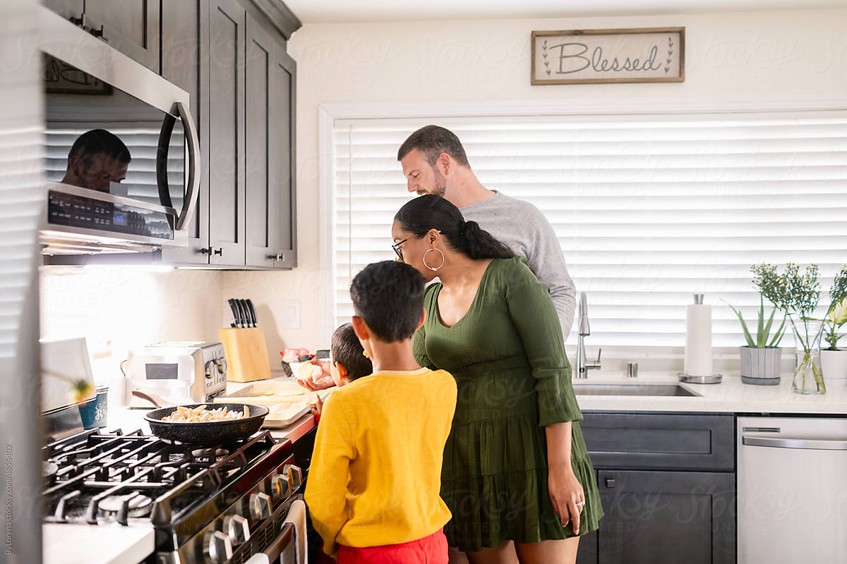 Diverse Family preparing lunch at kitchen