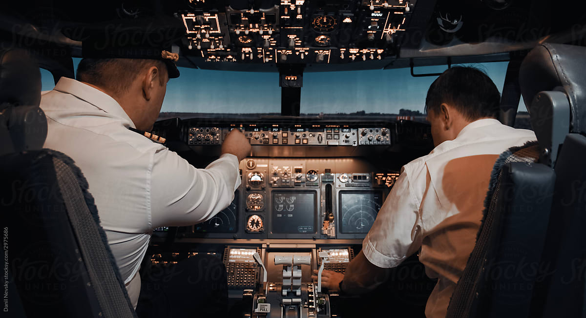 Professional pilots in airplane cockpit