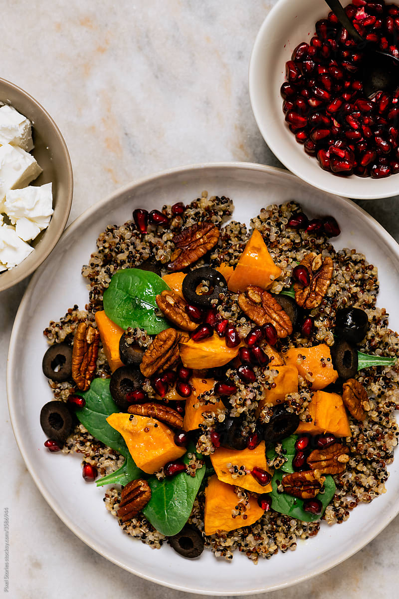 Easy winter salad with sweet potatoes, quinoa, spinach and pomegranate